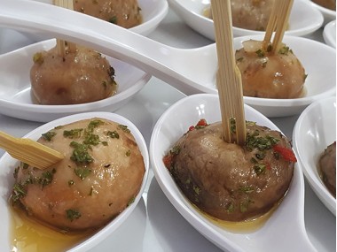 Mushrooms in vinaigrette served in a spoon